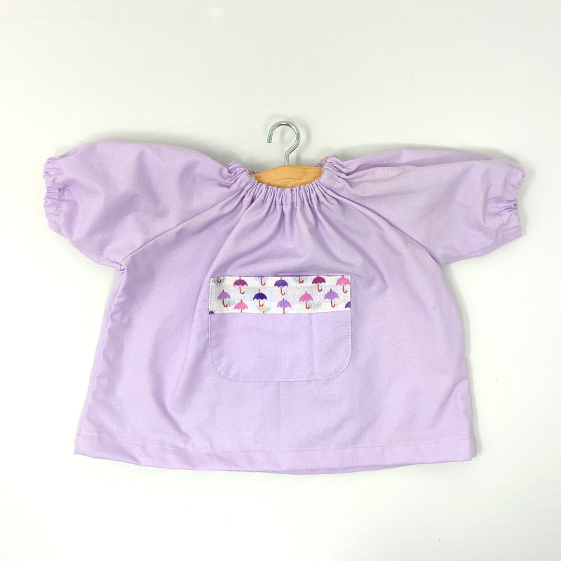 Grembiule per bambole per scuola e asilo - viola pastello 